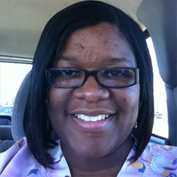 Image of smiling woman with dark hair.