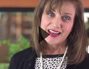 Image of smiling woman with dark hair.