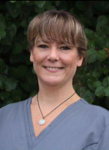 Image of smiling woman with dark hair.