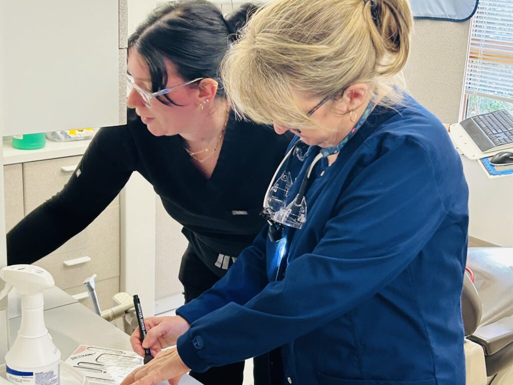 women working at dentist office