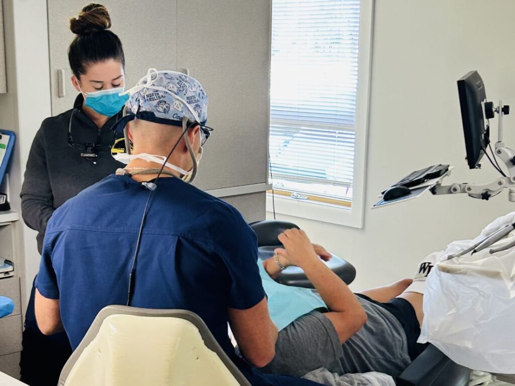 dentists working with patient